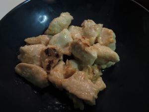 Cooked chicken with onions.