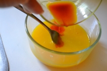 Saffron being added to the Egg yolks.
